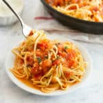 Pasta Pomodoro is a hands-down my family's favorite weeknight pasta! It's seriously quick and easy to make with the most simple ingredients like tomatoes, fresh basil, garlic and olive oil. We all fight for seconds in our house!