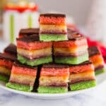 Whether you call these authentic Italian cookies Neapolitan Cookies, Tricolor Cookies or Rainbow Cookies, they are so delicious and are a gorgeous addition to any cookie platter! These are perfect for Christmas or any other holidays and special occasions. The almond paste and chocolate add such fantastic flavors along with the fruitiness of the raspberry and apricot preserves.