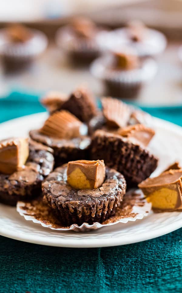 A plate of Peanut Butter Cup Brownie Bites with others out of focus in the background.