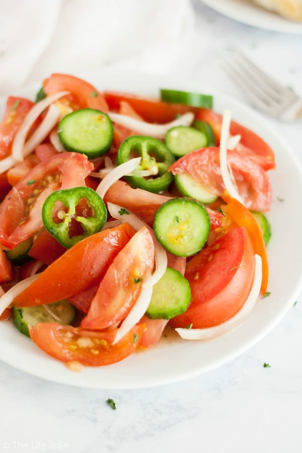 cucumber tomato onion salad on a plate