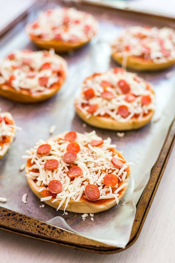 An image of Freezer Friendly Pizza Bagels that on a pan fresh out of the freezer.