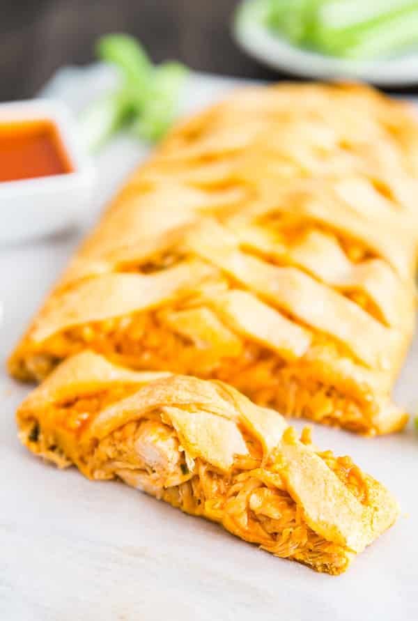 A Buffalo Chicken Braid with a slice of it in the front.
