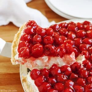 Rosie's Award Winning Cherry Cheese Pie is a favorite family recipe- it is insanely easy and heavy cream, cream cheese, vanilla, confectioner's sugar and cherries make up the minimal ingredients. It looks gorgeous on any dessert tables, especially for the holidays and could not be more delicious! Get in the kitchen and make this now!