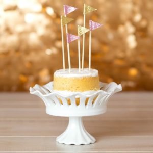 These DIY Flag Cake Toppers are perfect for a custom birthday or a wedding cake! They are so easy to make and can be personalized in whatever unique way you'd like!