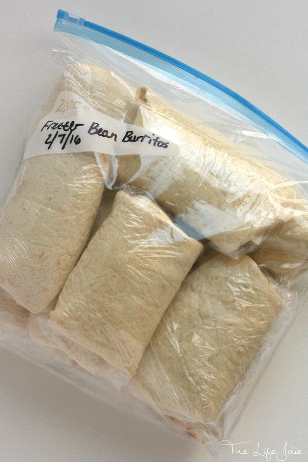 These Freezer Bean Burritos are so simple and easy to make and are delicious grab-and-go lunches or dinners. Our family loves them!