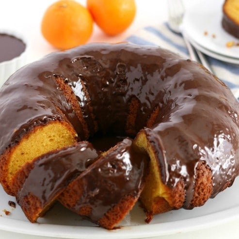 This Orange Cake with Chocolate Ganache Glaze is super easy to make. It's a cake mix hack recipe that comes out so moist and delicious- this one's a keeper!