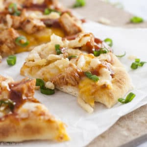 Need a quick meal for those busy back-to-school nights when you're shuffling between activities? Look no further! This BBQ Chicken Flatbread Pizza is the perfect weeknight meal. It is really quick and easy to make- juicy grilled chicken, melty cheese, tangy BBQ sauce and crunchy fried onions. This is a meal your whole family will enjoy!