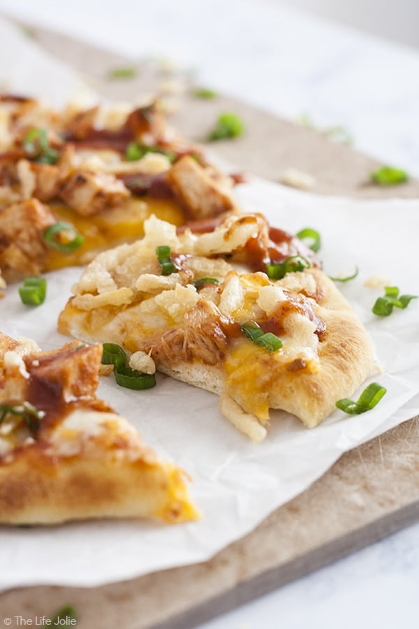 Need a quick meal for those busy back-to-school nights when you're shuffling between activities? Look no further! This BBQ Chicken Flatbread Pizza is the perfect weeknight meal. It is really quick and easy to make- juicy grilled chicken, melty cheese, tangy BBQ sauce and crunchy fried onions. This is a meal your whole family will enjoy! 