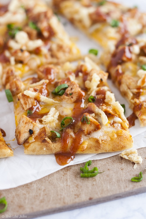 Need a quick meal for those busy back-to-school nights when you're shuffling between activities? Look no further! This BBQ Chicken Flatbread Pizza is the perfect weeknight meal. It is really quick and easy to make- juicy grilled chicken, melty cheese, tangy BBQ sauce and crunchy fried onions. This is a meal your whole family will enjoy! 