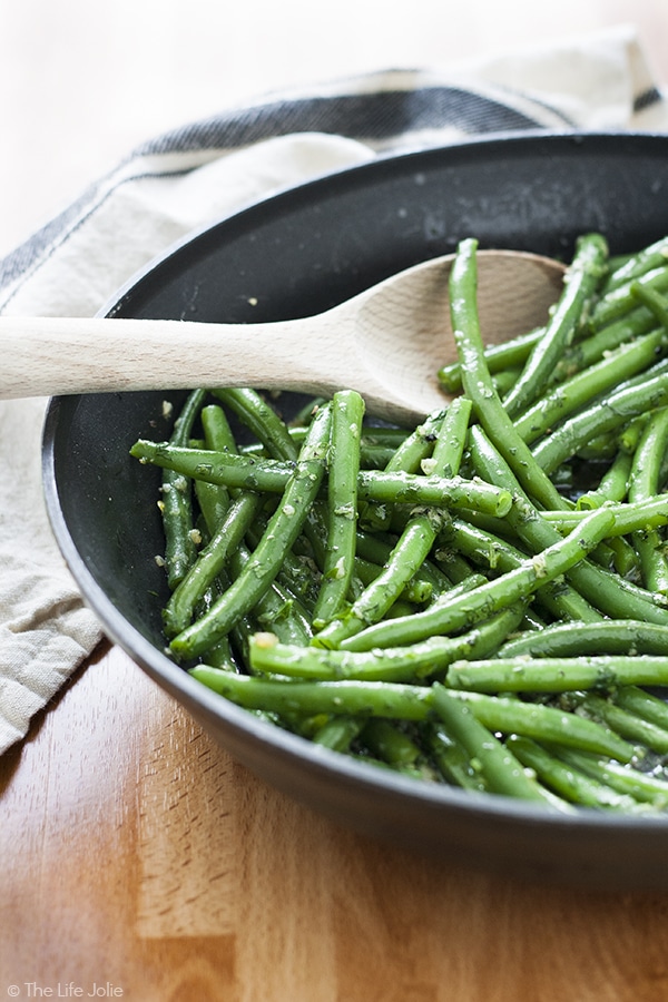 Garlic Green Beans is one of my favorite side dish recipes! It's easy to make and pretty healthy with Crispy Green Beans sauteed in a skillet. Fresh parley adds a great, herbaceous brightness with a little bit of butter and garlic. This is special enough food for Thanksgiving or any other holiday meal and also great in a pinch on a busy weeknight!