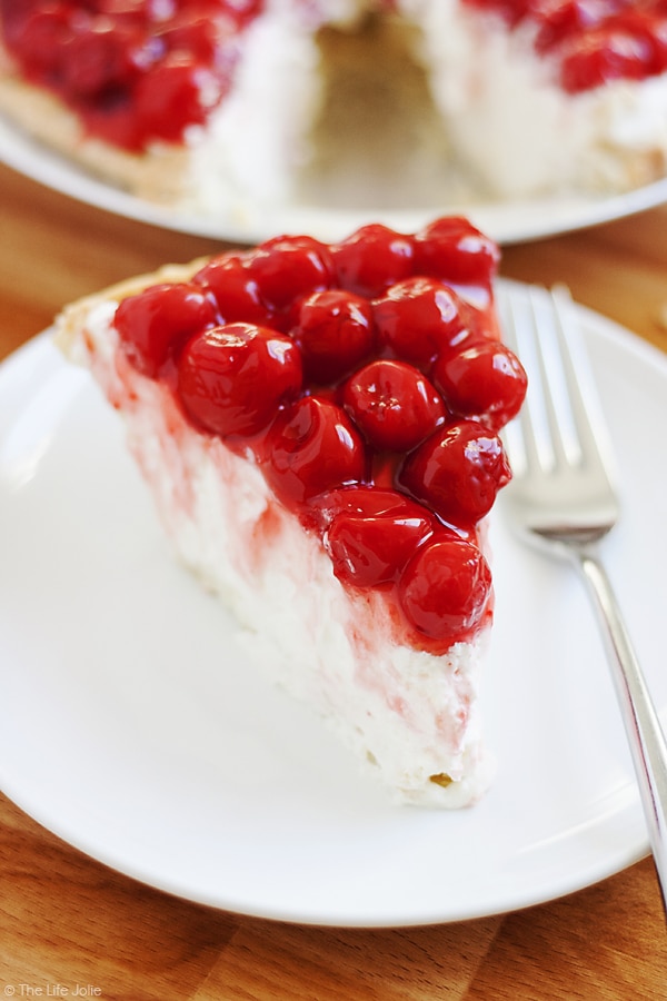 Rosie's Award Winning Cherry Cheese Pie is a favorite family recipe- it is insanely easy and heavy cream, cream cheese, vanilla, confectioner's sugar and cherries make up the minimal ingredients. It looks gorgeous on any dessert tables, especially for the holidays and could not be more delicious! Get in the kitchen and make this now!