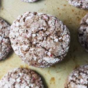 These Chocolate Peppermint Crinkles are an easy way to add a fun spin to a traditional recipe. These cookies are chewy and fudgy but they also have a delicious mint flavor. They are the best Christmas cookie for kids to make and eat!