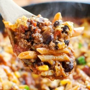 20 Minute Taco Pasta is such an easy one pot recipe. This tasty dinner is made in one skillet with ground beef and Barilla Pronto Penne Pasta. It's creamy, cheesy and full of great flavor that the whole family will love!