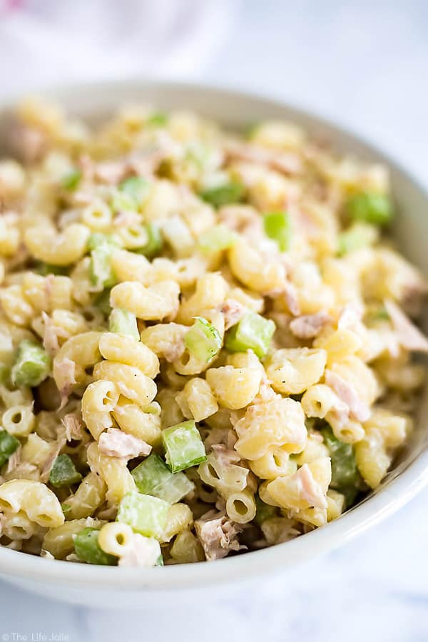A close up image of a bowl zooming in on the details of tuna macaroni salad.