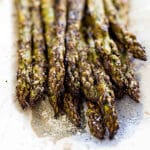 This easy Balsamic Grilled Asparagus recipe is the absolute best way to cook asparagus! It only takes 15 minutes and cooks up perfectly on your BBQ  for a simple, crispy, healthy and flavorful summer side dish.
