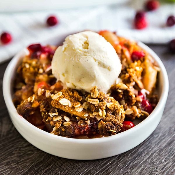 A square image of Cranberry Apple Crisp Recipe with Oatmeal Ginger Snap Topping.