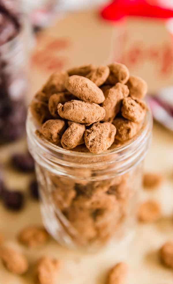 A jar of Chocolate Almond Candy covered in cocoa and chili.