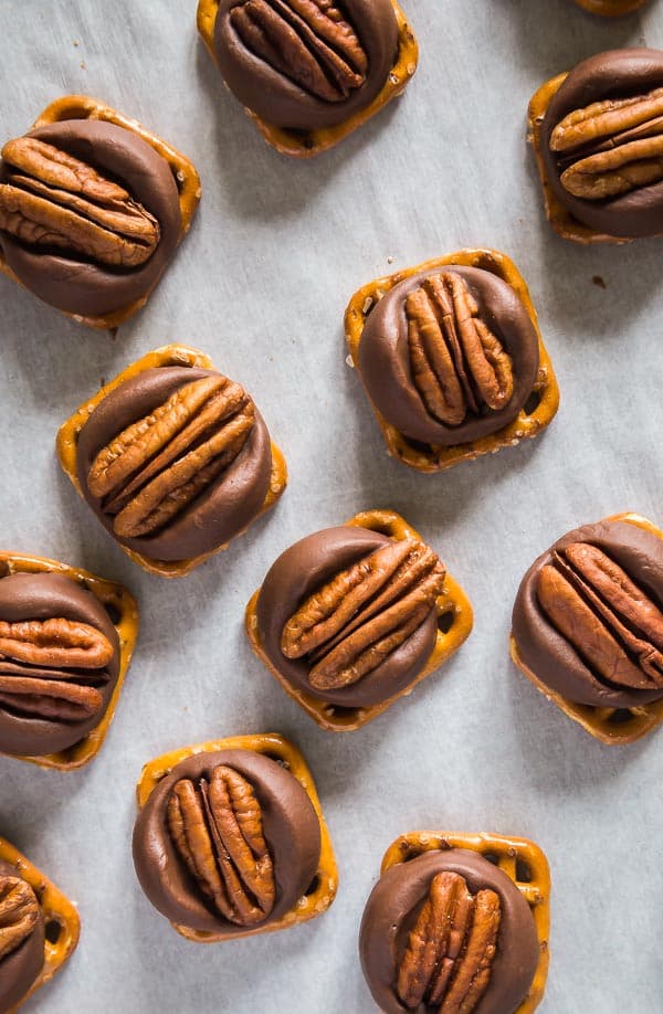 An overhead shot of Chocolate Caramel Pretzel Turtles on a parchment lined pan.