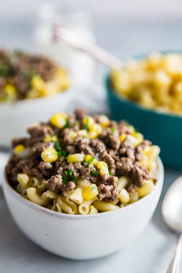 Classic Hamburger Stew over elbow macaroni in a bowl.