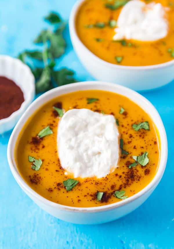 A bowl of Instant Pot Butternut Squash Soup with another bowl behind it.