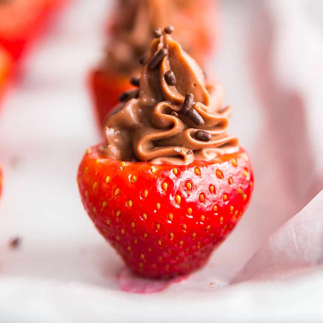 A square image of Chocolate Cheesecake Stuffed Strawberries.