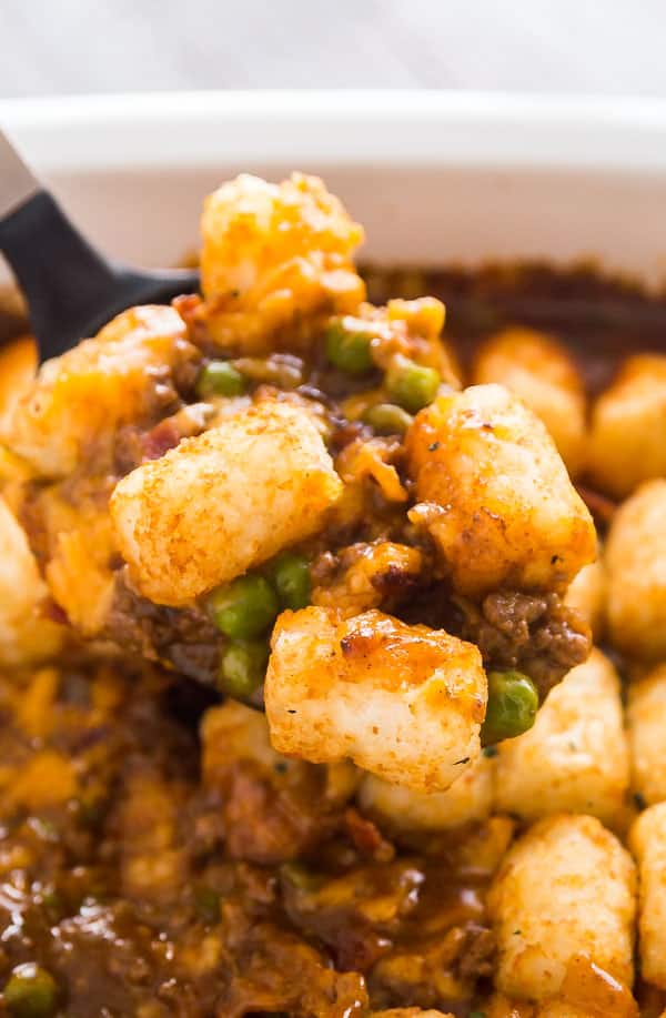 My kids do not stop requesting this Bacon Cheeseburger Tater Tot Casserole Recipe; it's simple comfort food at it's finest and perfect for busy weeknights! It's super quick and easy to make and deliciously cheesy.