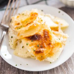 Mom's Homemade Scalloped Potatoes are the perfect creamy side dish for a family dinner. With thinly sliced potatoes and onions, salt, pepper and milk with the option to add Romano cheese, these will bring everyone back for seconds!