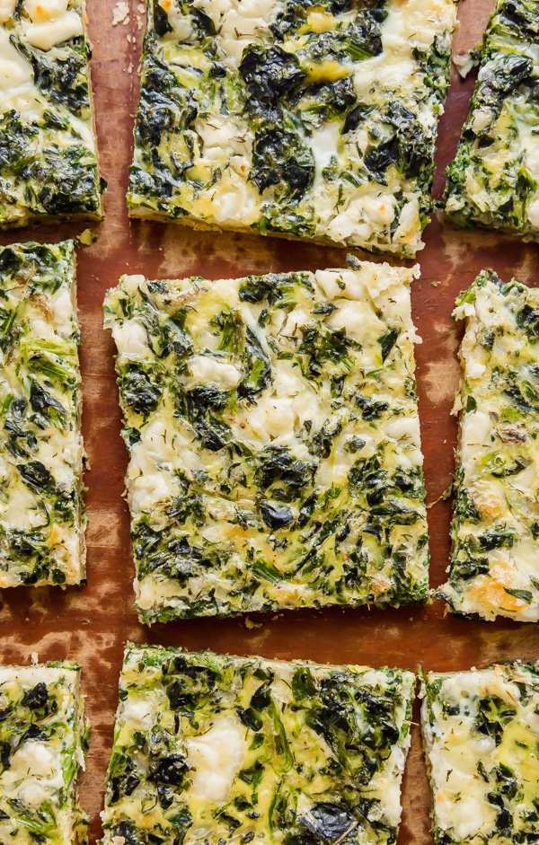 Spinach and Feta Breakfast Puff Pastry Pizza is light and savory with a flaky puff pastry crust. This is the perfect, easy, throw-together brunch option!