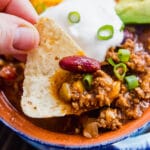 Easy Instant Pot Chili will knock your socks off. Ready in around 30 minutes and full of mouthwatering flavor! Full of ground beef, ground pork, tons of chili seasonings, vegetables and beans it's quick and easy to make on a week night or for a party (game day anyone?!).