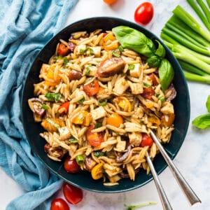 We all love a Caprese salad, but what's even better? Caprese Pasta Salad! Sweet tomatoes and basil, tender fresh mozzarella cheese and orzo pasta make a salad that you won't be able to stop eating!