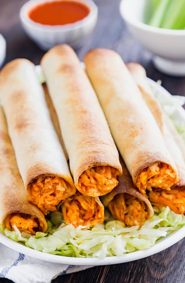 Meet your new favorite appetizer: Baked Buffalo Chicken Taquitos. Made with shredded chicken, buffalo sauce, ranch seasoning and mozzarella cheese, these are a quick and delicious way to become the most popular person at the party!