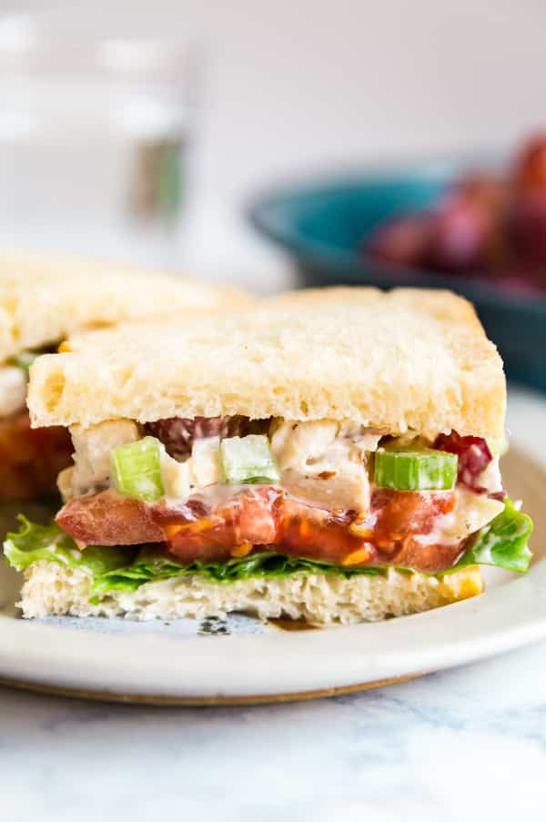 Copycat Panera Bread Napa Almond Chicken Salad Sandwich is one of my favorite light lunches. Made with grapes, almonds and celery, it's seriously quick and easy to make and a great way to repurpose leftover chicken!