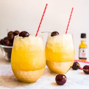Black Cherry Lemonade Bourbon Slush is the most easy and delicious boozy recipe to bring to a party. It takes minutes to put together and then you freeze it overnight. Made with Lemonade and Red Stag Black Cherry Bourbon Whiskey, everyone goes crazy over this!