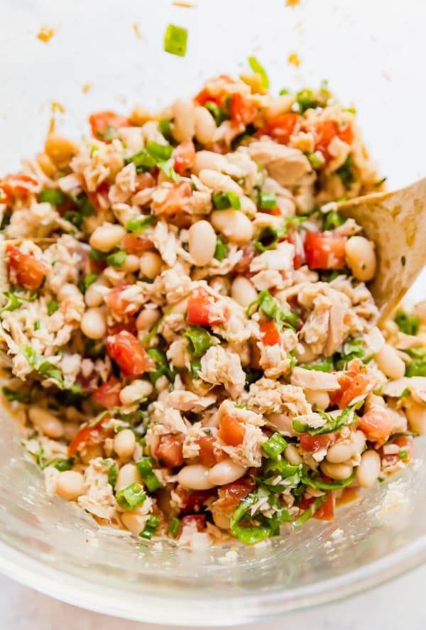 Italian Tuna Salad makes the perfect light and fresh lunch! This is a healthy (no mayo!) but satisfying option that is super easy to make and comes together in minutes so it's quick. Made with tuna, tomatoes, fresh basil and oregano, green onion, lemon juice and olive oil this will be your new favorite lunch option!