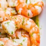 This Garlic Shrimp with Lemon, Butter and Dill will knock your socks off. It's full of insanely delicious flavor and extremely quick and easy to make with shrimp, butter, olive oil, dill, lemon, garlic and shallots!