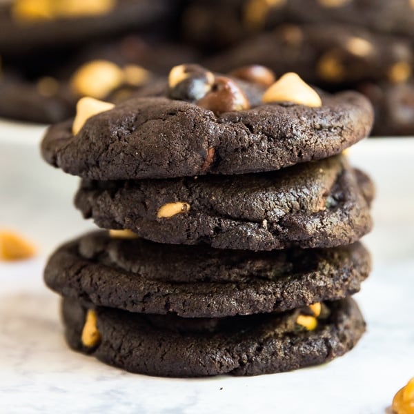 Do you like super rich, decadent desserts? If so, these Peanut Butter Double Chocolate Chip Cookies are right up your alley! Made with dark cocoa powder, chocolate chips and peanut butter chips, these are seriously easy to whip up last minute and also freeze well!