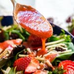 Summer Bounty Strawberry Salad with Fresh Strawberry Vinaigrette is a light and fresh lunch! Made with some unexpected ingredients like greens, strawberries, white cheddar, sunflower seeds and dried cherries this salad is as healthy as it is delicious!