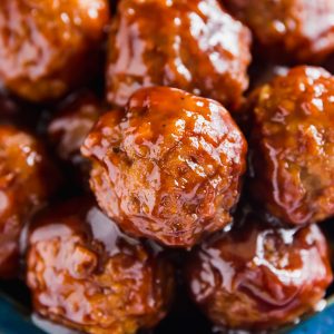 BBQ Crockpot Meatballs: 5 ingredients, minimal effort and maximum flavor! We use premade meatballs, ketchup, brown sugar, liquid smoke and onions. This is a killer party or game day appetizer that your friends will love!