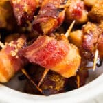 Make these Brown Sugar Bacon Wrapped Chicken Bites for your next gathering! Made with chicken, bacon, brown sugar, salt and pepper, they're a sweet and savory appetizer the whole family will love!