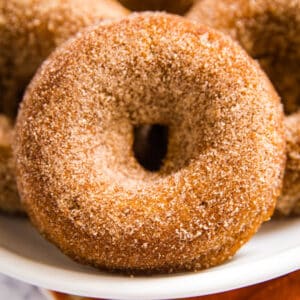 You've got to make this Baked Pumpkin Donut Recipe! They're the most light and fluffy donuts that are perfect with your morning coffee and best of all they're really quick and easy to make.