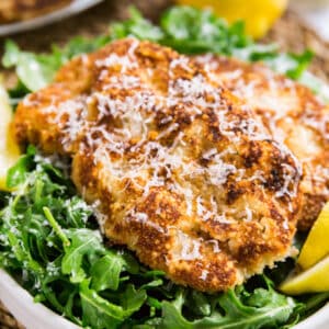 Veal Scallopini Milanese Style is a seriously easy weeknight dinner that's on the table in under 20 minutes. Made with veal cutlets, seasoned bread crumbs and Parmesan cheese, this is a light and healthy dinner that's full of delicious flavor!