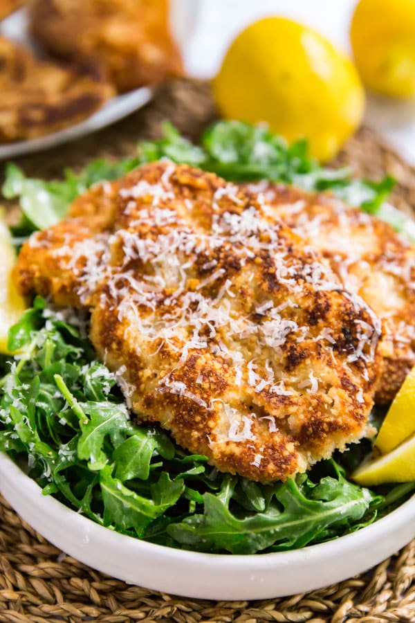Veal Scallopini Milanese Style is a seriously easy weeknight dinner that's on the table in under 20 minutes. Made with veal cutlets, seasoned bread crumbs and Parmesan cheese, this is a light and healthy dinner that's full of delicious flavor!
