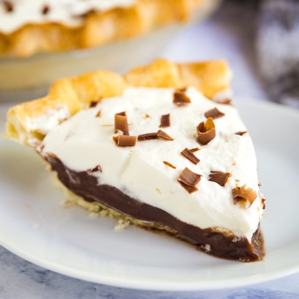 My family makes this Easy Chocolate Cream Pie over and over again. Made with chocolate pudding, pie crust and fresh whipped cream, it's effortless to put together and we always fight for seconds!