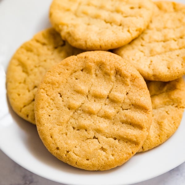 These classic peanut butter cookies are just like the old fashioned cookies your mom used to make; nice and chewy in the middle with just a tiny bit of crunch around the edges. This has been a family favorite recipe for generations!