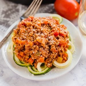 This simple Weeknight Bolognese Sauce made with ground veal comes together in less than 30 minutes and is bursting with delicious flavor! Serve it over zoodles for a carb conscious dinner that is as tasty as it is nutritious!