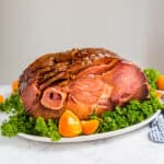 Wanna prepare your holiday ham the easy way? Make this Crock Pot Ham! Made with a spiral ham, brown sugar, bourbon and hot sauce, it's just 5 minutes of work for you and the slow cooker does the rest!