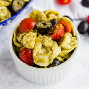 Pesto Tortellini Salad is the easiest pasta salad you'll make! Throw this quick and delicious pasta salad together in minutes and wow your friends and family!
