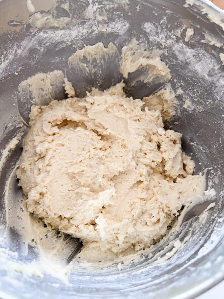 THe thicker batter in the mixer bowl after the dry ingredients have been mixed in.