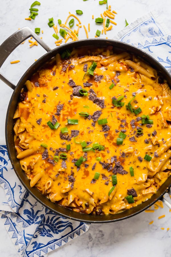 An overhead image of a pan of cheesy taco pasta