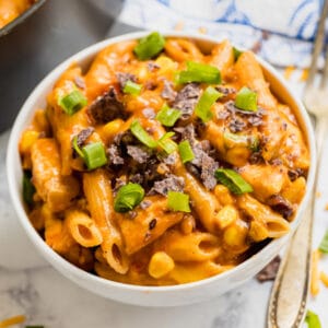 One Pot Chicken Taco Penne Pasta is the 30 minute meal of your dreams! Cheesy, creamy and full of great flavor, this easy Taco Pasta adds a great variation for Taco Tuesday.
